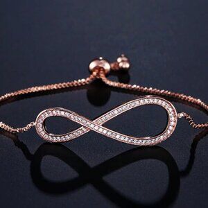 Jewelry bracelet infinity style rose gold tone with stones sparkly adjustable